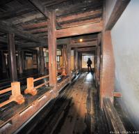 Japanese castle interior, warriors running passage