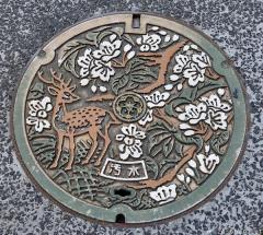 Nara deer and cherry blossoms manhole cover