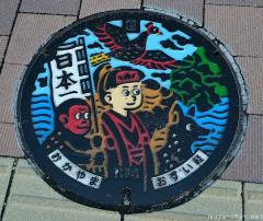 Okayama artistic manhole cover with the Momotaro legend