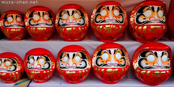 Set of japanese new year daruma dolls. Traditional daruma dolls in