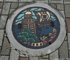 Sakata lighthouse and kitamaebune manhole cover