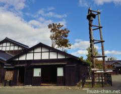 Traditional Japanese fire lookout tower at Matsumaehan Yashiki
