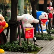 Anime character statues in front of the Bandai building in Asakusa